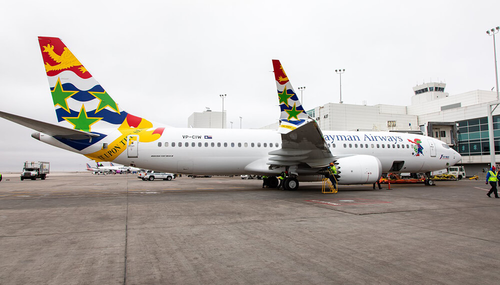 cayman airways celebrates inaugural flight from cayman to denver